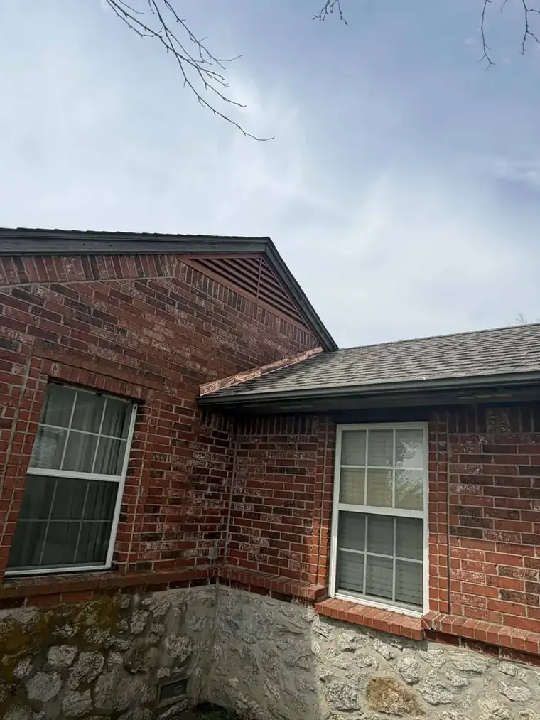 Finished gable end: new shingles, fresh valley metal and clean gutter line — Bartlesville Roofing & Gutters, Bartlesville OK