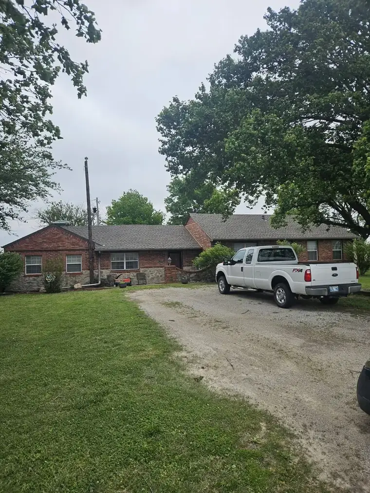 Rural Washington County ranch, finished roof, our truck in the drive — Bartlesville Roofing & Gutters, Bartlesville OK