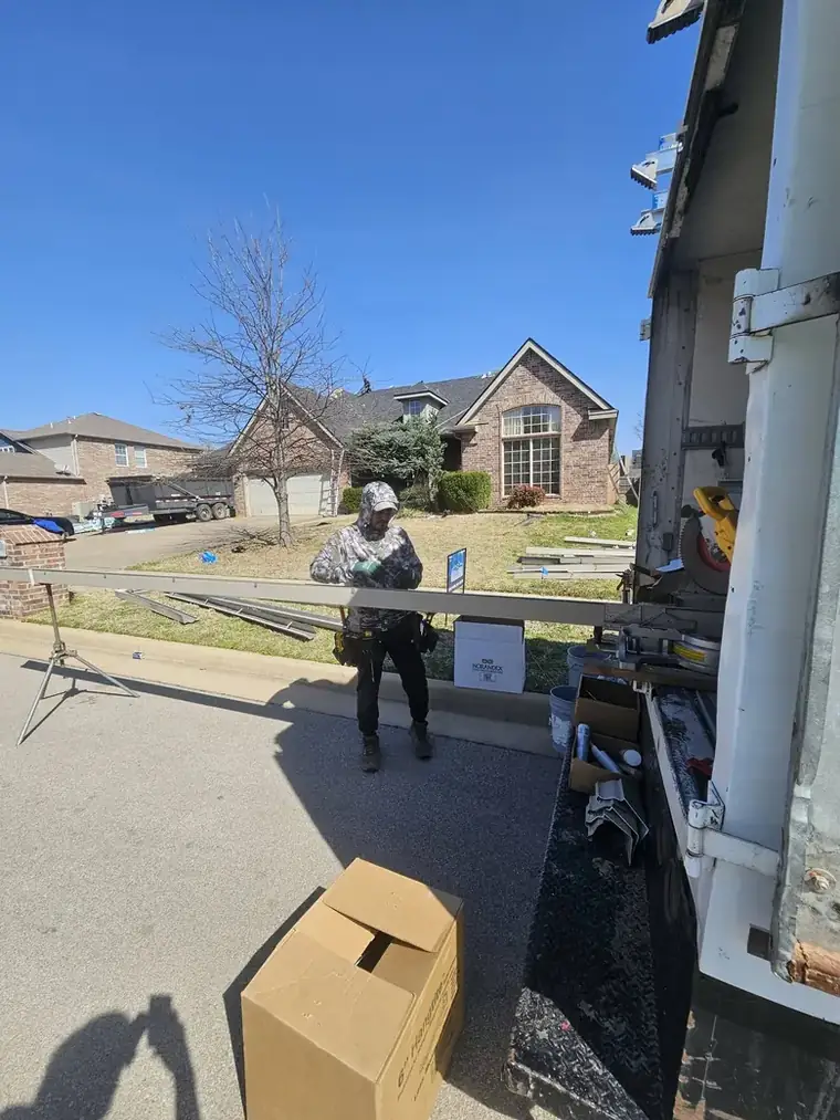 Seamless gutter run rolled to length on site at the gutter machine — Bartlesville Roofing & Gutters, Bartlesville OK