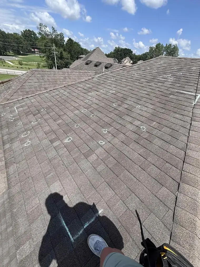 Hail inspection: the whole slope chalked, hit by hit, with a marked test square — Bartlesville Roofing & Gutters, Bartlesville OK